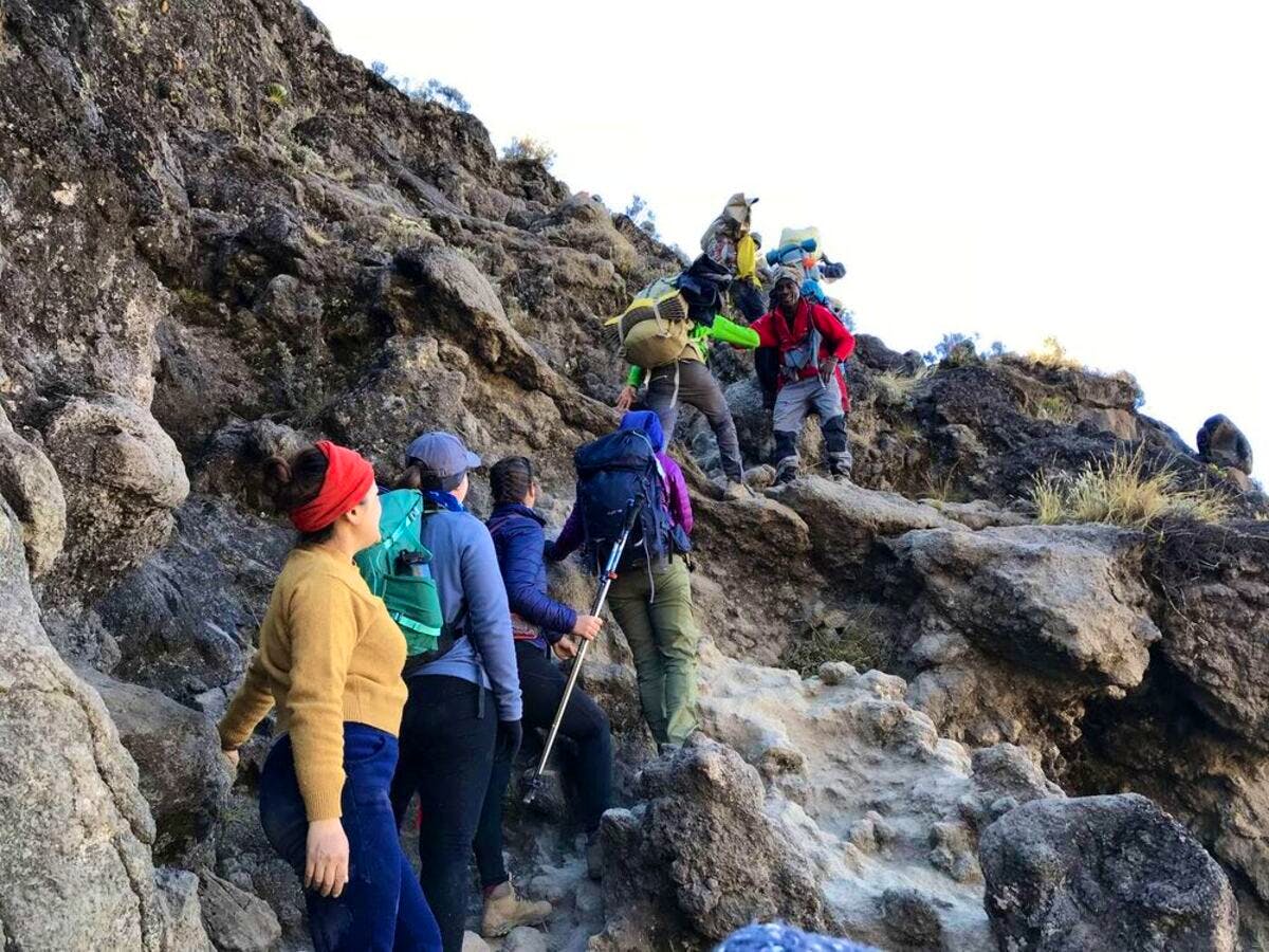hikers scaling kilimanjaro barranco wall