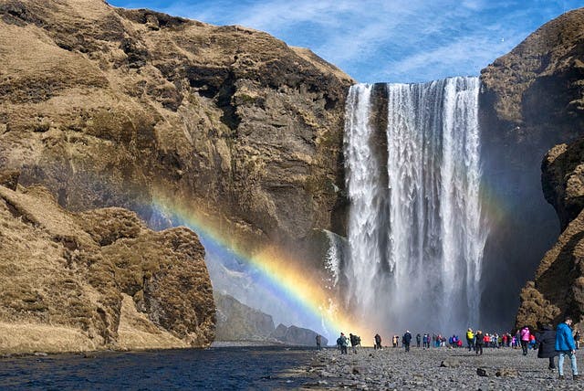Iceland waterfall with tourists