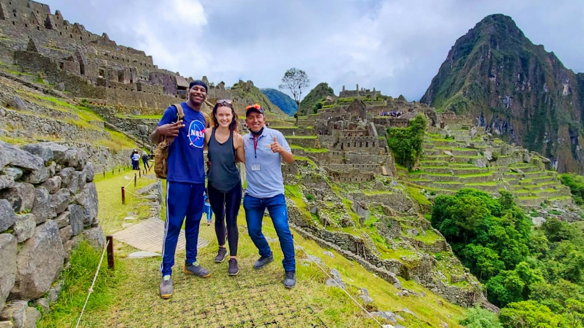hikers at machu picchu ruins