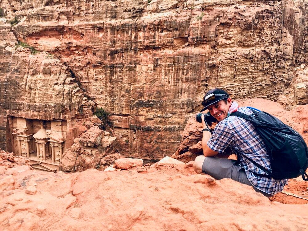 hiker taking pictures in petra
