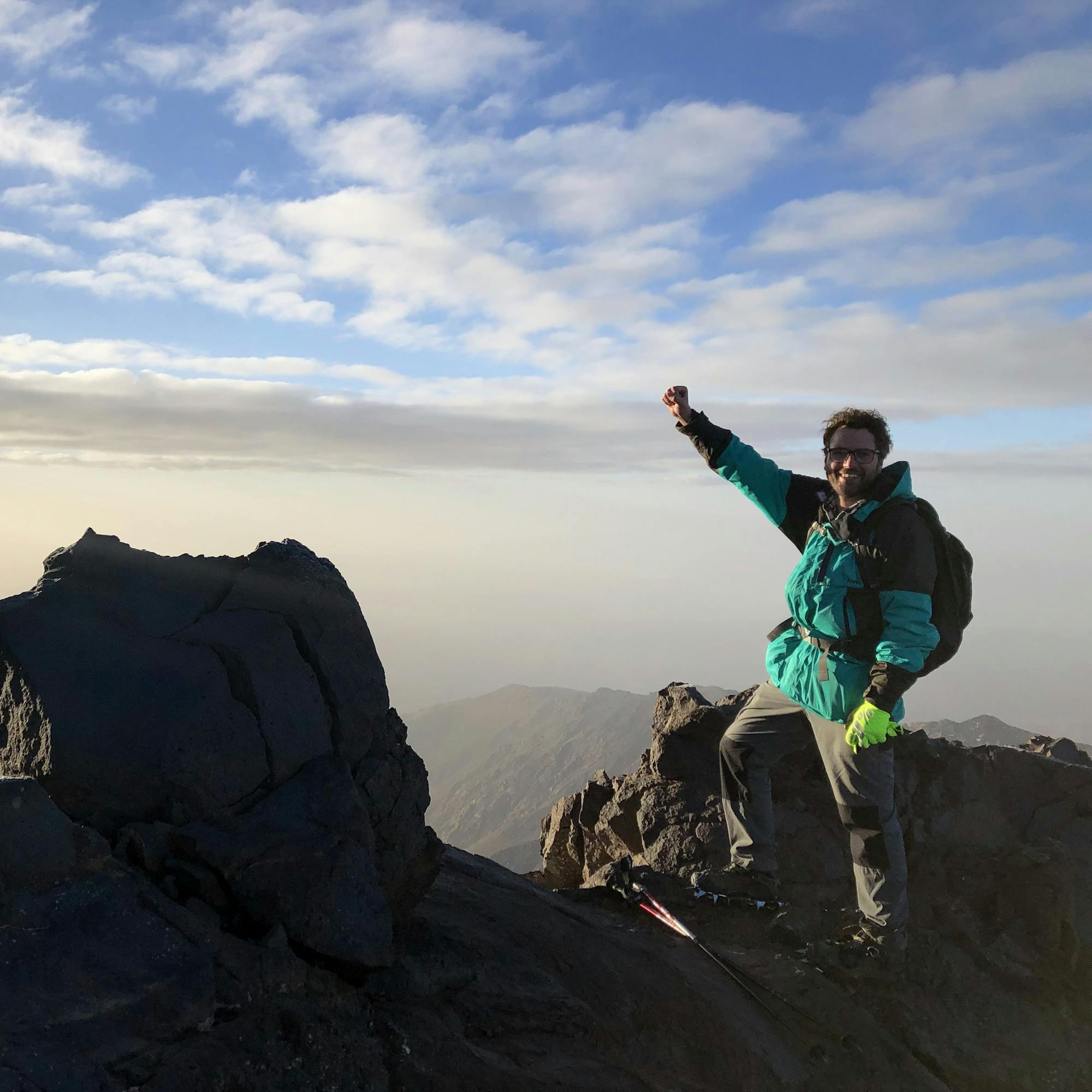 climber reaching top of mt toubkal