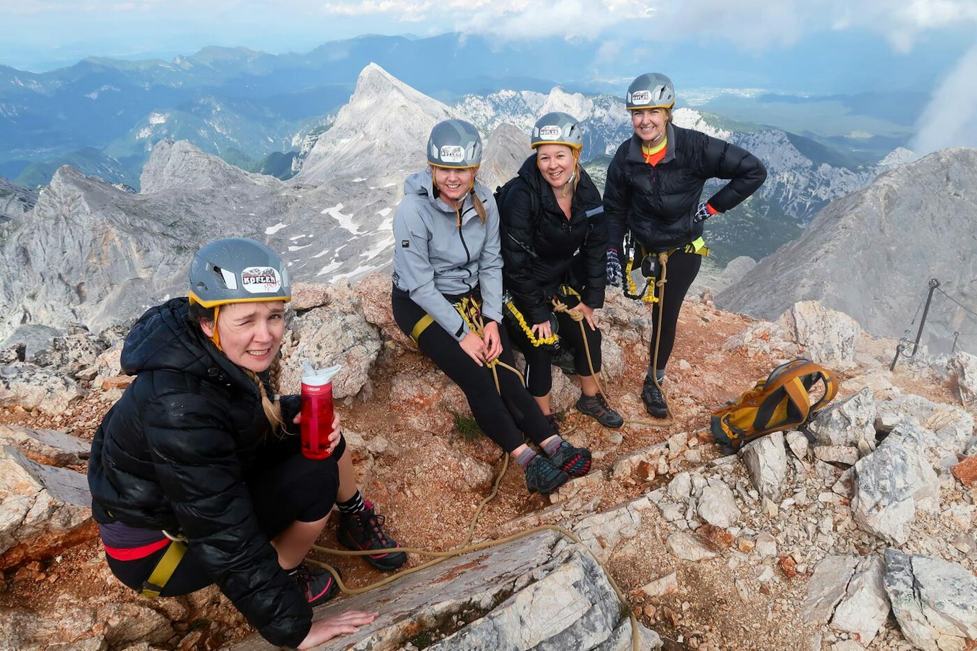 hikers summitting triglav