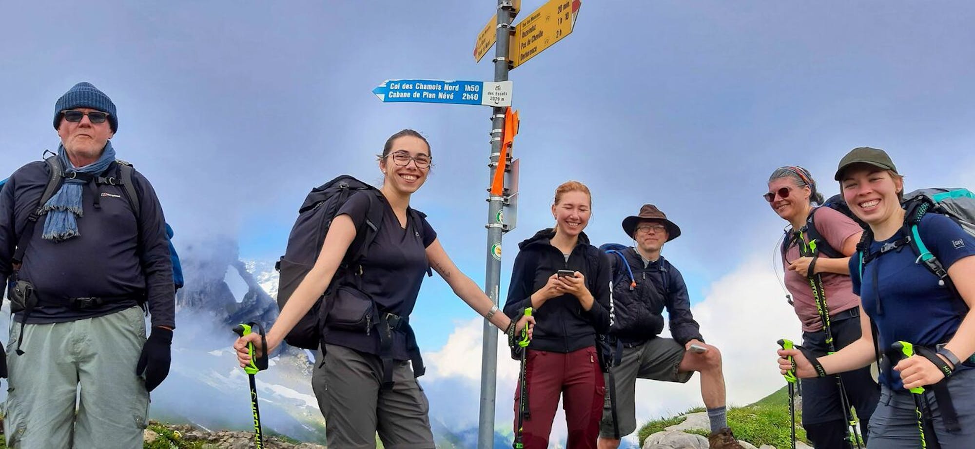 happy hikers in swiss alps