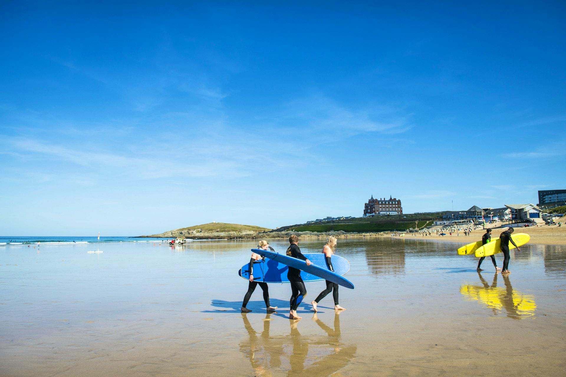 surfers at fistral beach
