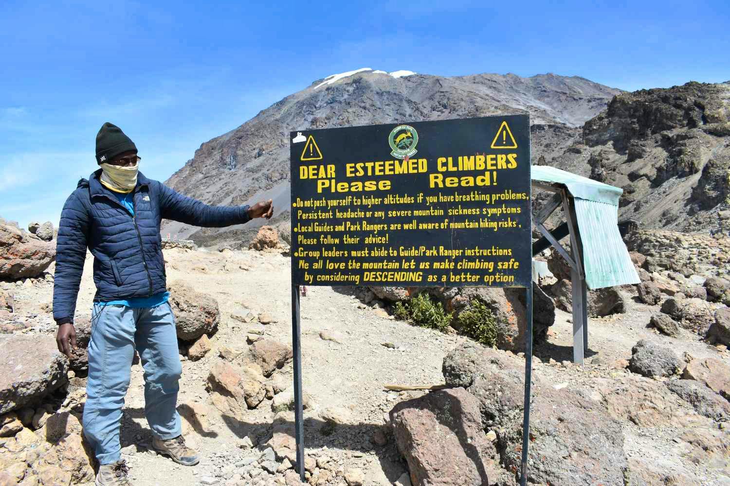 climber warning sign kilimanjaro